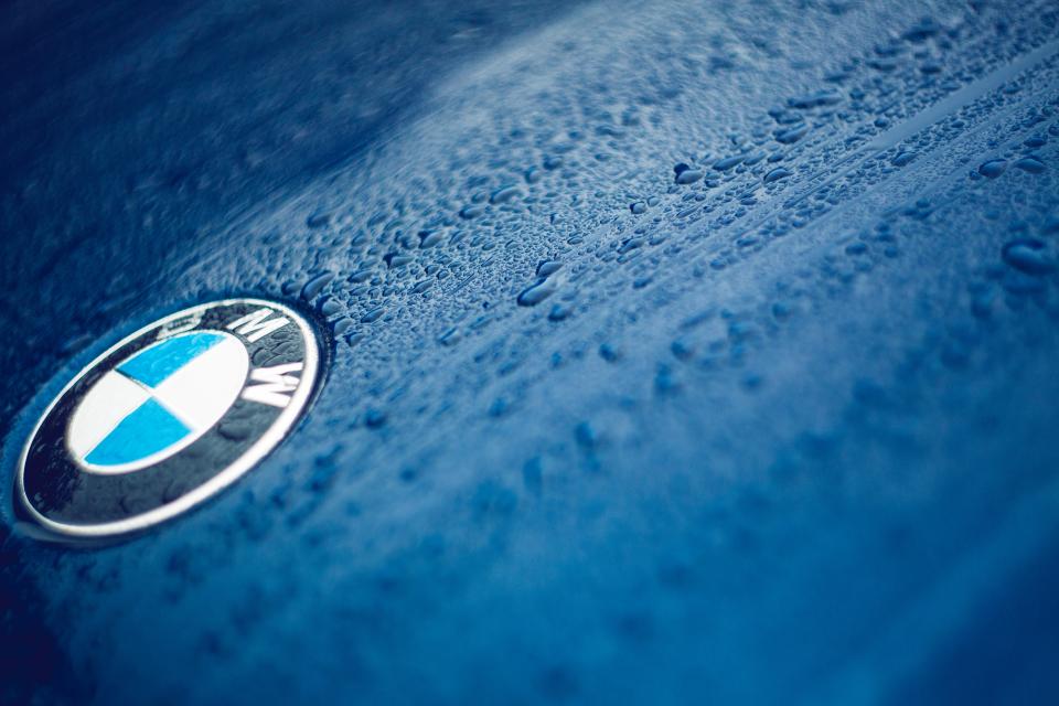 Detailed luxury vehicles in a driveway